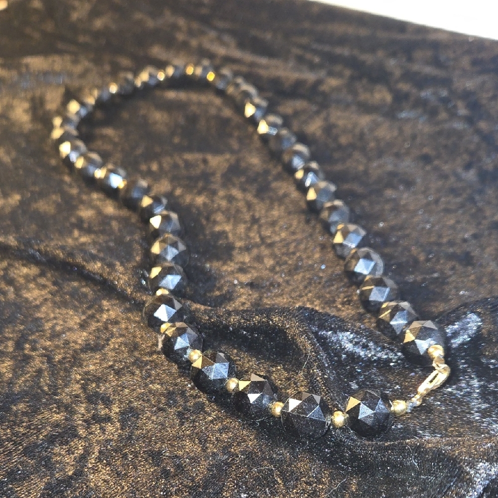 Black Geometric and Gold Necklace with Sophisticated Design